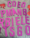 Red and purple glitter letters and decals