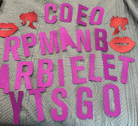 Red and purple glitter letters and decals