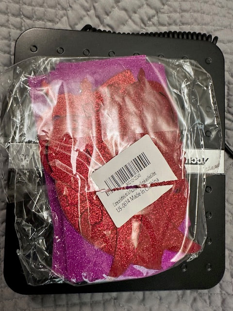 Red and purple glitter letters and decals